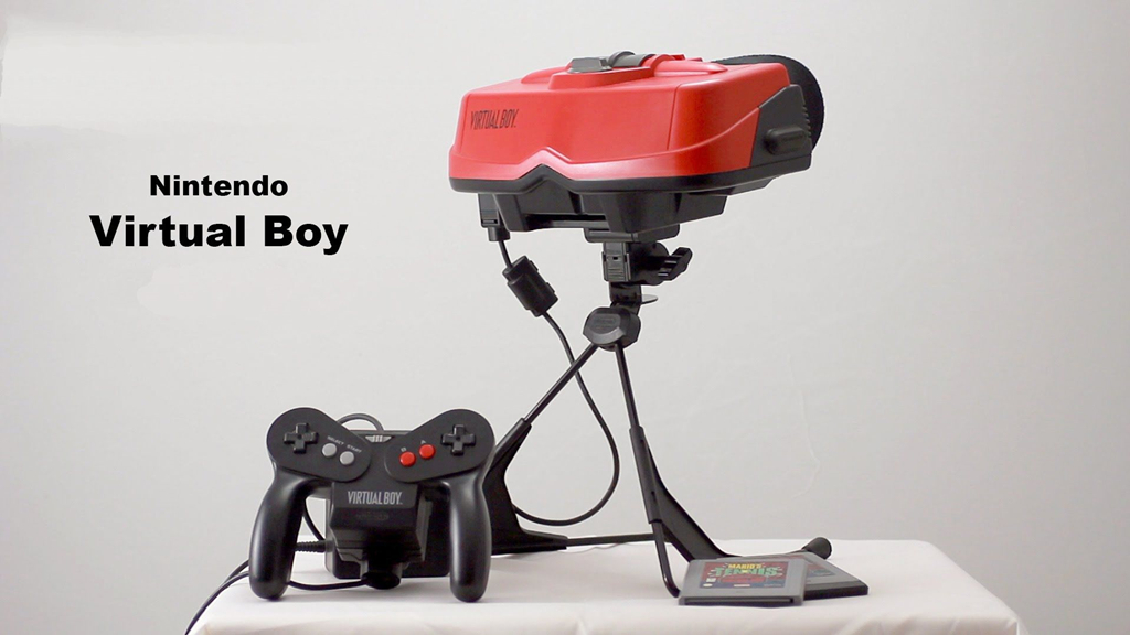 NO.2 Virtual Boy
Virtual Boy可以算是最早期的类VR设备，它和其他普通的家用游戏机设计完全不同，光从外观看非常另类，黑红头戴液晶屏幕作为显示器及主机看起来应该不错。但是，其游戏效果却非常差劲，戴起来也令人眩晕，最终导致失败。
